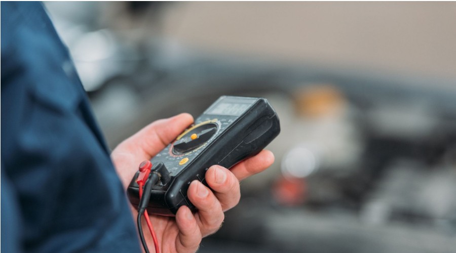 electrician holding a multimeter