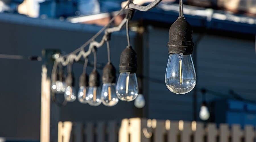 Close-up of black string lights with lightbulbs