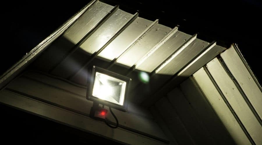 An outdoor LED motion detector light at night