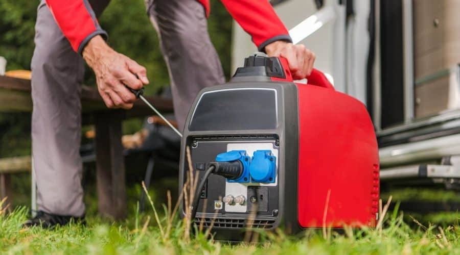 Somebody pulling the cord on a red portable generator