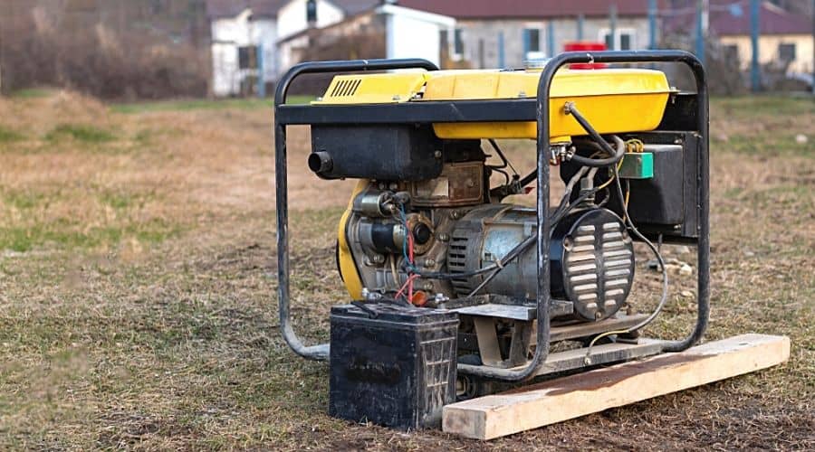 An old gasoline-powered generator on a lawn