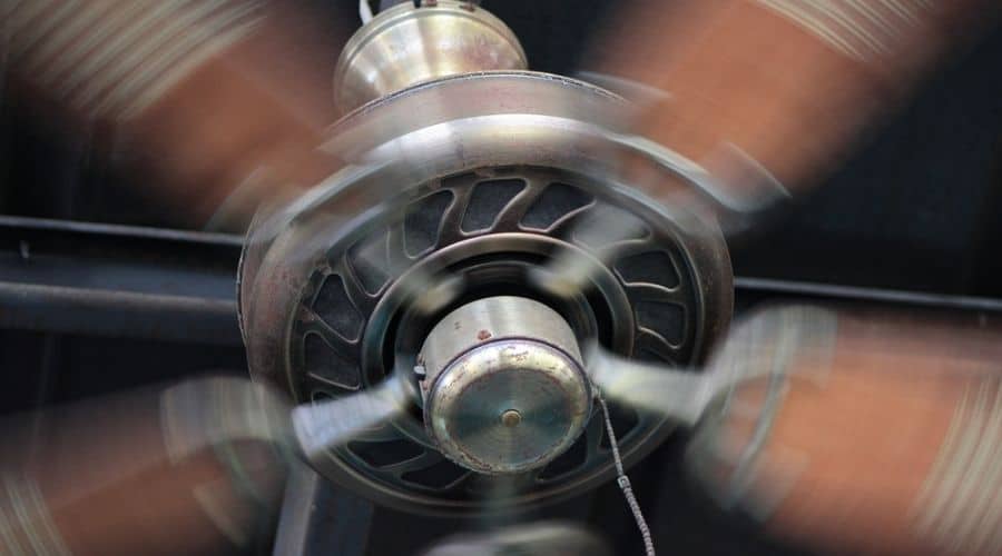 A slightly blurred photo of a running ceiling fan