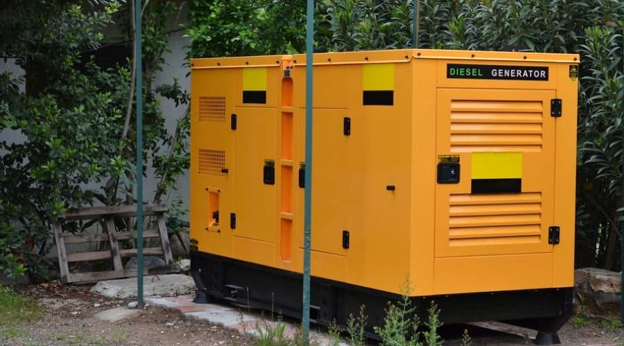 A large, yellow residential standby generator