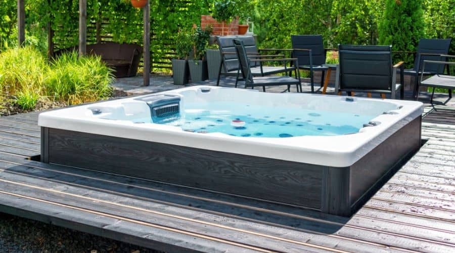 a hot tub sits on a deck