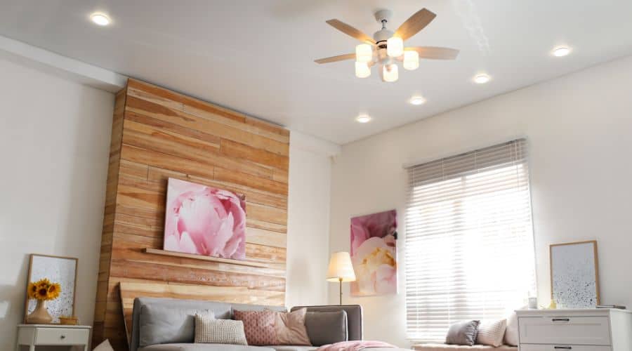 a ceiling fan in a bedroom
