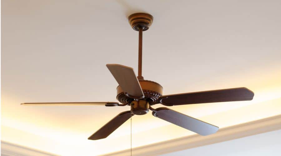 a closeup of a brown standard mount ceiling fan