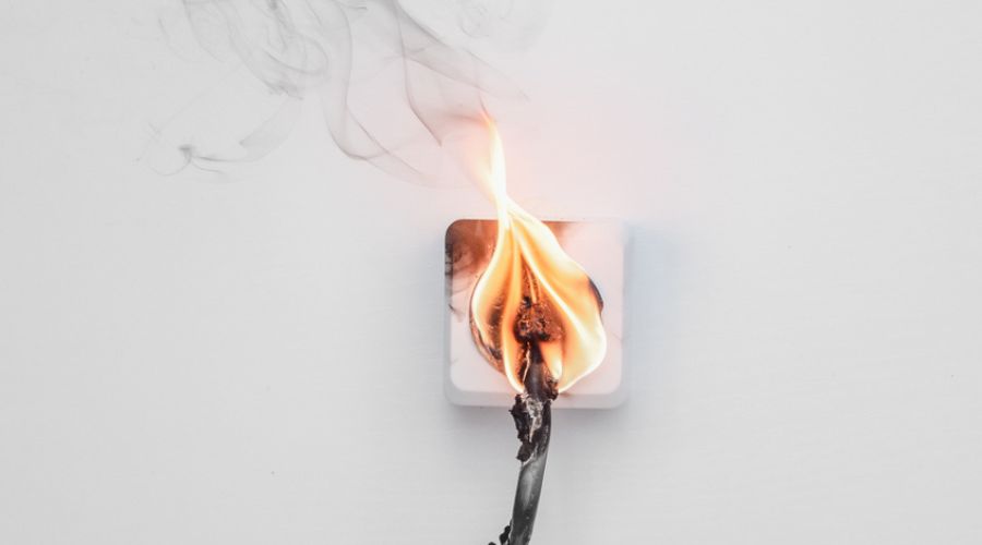 an electrical outlet that is on fire
