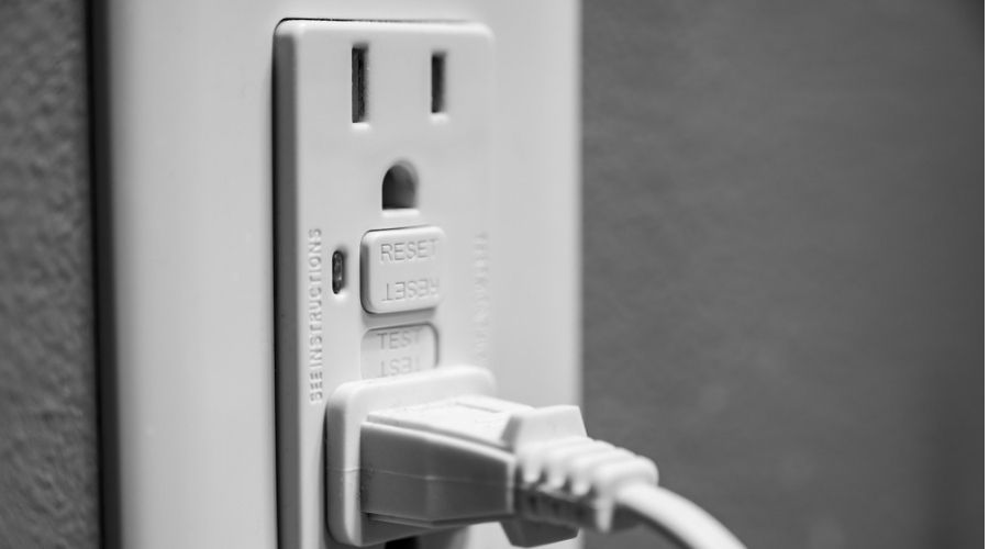 a closeup of a plug in an electrical outlet