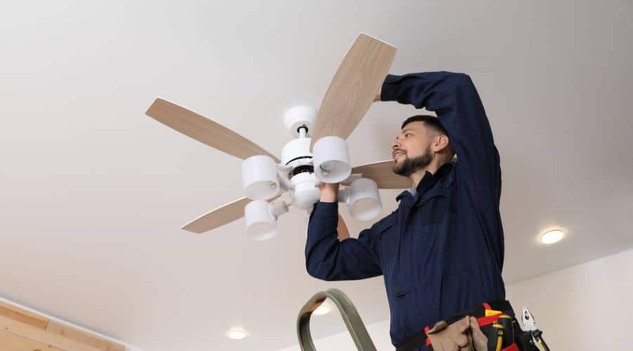 professional installing a ceiling fan